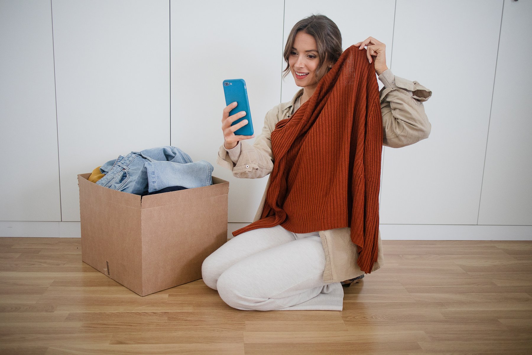 Woman Donating Decluttered Clothes Online